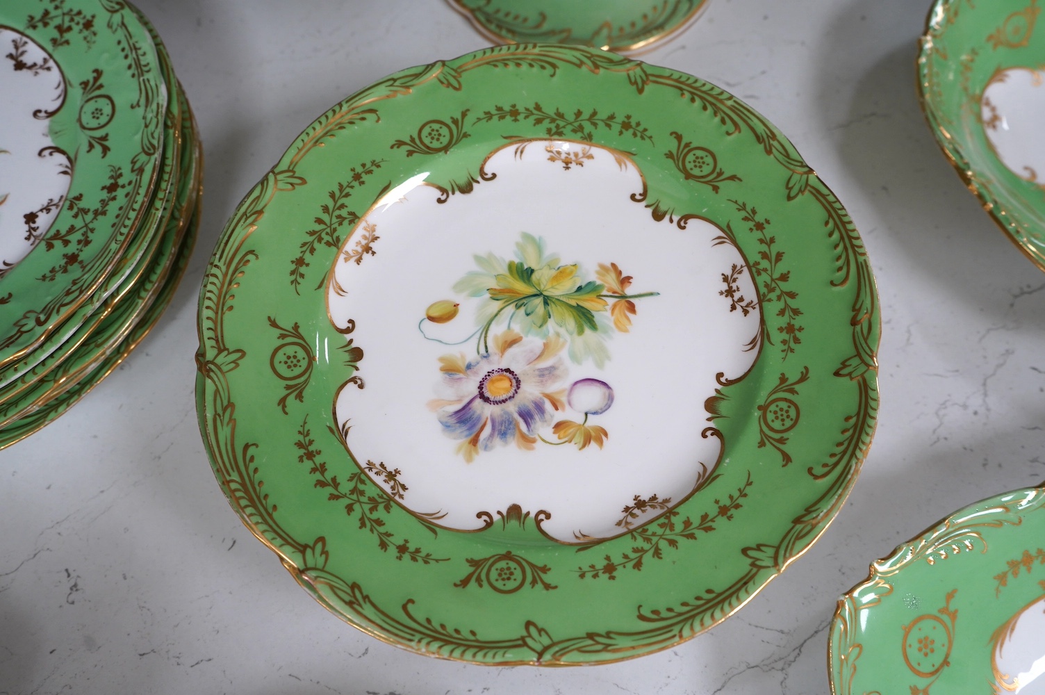 A mid 19th century English porcelain part dessert service hand painted with flowers, largest 30cm wide. Condition - mostly good